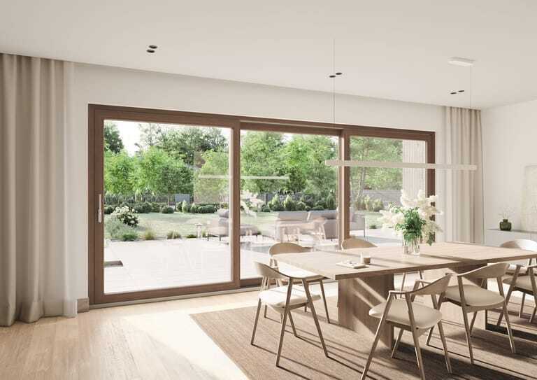 Die großformatige Hebeschiebe-Tür Schüco FocusIng Slide sorgt für lichtdurchflutete Räume.